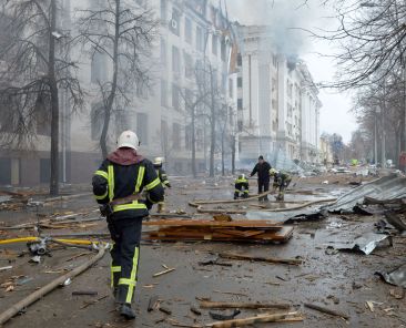 Firefighters work to contain a fire at the Economy Department building of Karazin Kharkiv National University, allegedly hit during recent shelling by Russia, in Kharkiv on March 2, 2022. (Sergey BOBOK / AFP)