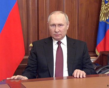 In this image made from video released by the Russian Presidential Press Service, Russian President Vladimir Putin addressees the nation in Moscow, Russia, Thursday, Feb. 24, 2022. Russian troops launched their anticipated attack on Ukraine on Thursday, as Putin cast aside international condemnation and sanctions and warned other countries that any attempt to interfere would lead to "consequences you have never seen." (Russian Presidential Press Service via AP)
