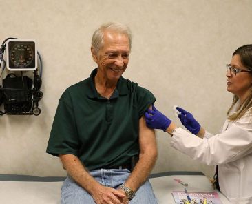 MIAMI, FL - OCTOBER 04: Stuart Goldstein receives an influenza vaccination from nurse practitioner, Katherine Male, at the CVS Pharmacy store's MinuteClinic on October 4, 2018 in Miami, Florida. CVS stores will provide flu vaccinations at their MinuteClinic as well as the pharmacy and according to the Centers for Disease Control and Prevention and the American Academy of Pediatrics between now and the end of October is the best time to get vaccinated as the flu season begins. Joe Raedle/Getty Images/AFP (Photo by JOE RAEDLE / GETTY IMAGES NORTH AMERICA / Getty Images via AFP)