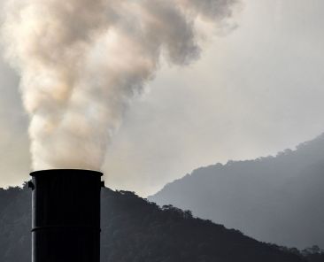 A factory chimney smokes at the industrial complex of Cubatao, Sao Paulo state, Brazil, on November 4, 2021. Brazil, which government has been criticised for its environmental policies, has committed itself during the COP26 to reducing greenhouse gas emissions by 50% by 2030, raising the target initially set at 43%, Environment Minister Joaquim Leite said during the conference. (Photo by NELSON ALMEIDA / AFP)